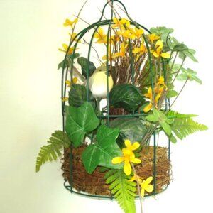 Bird in cage surrounded by pretty yellow flowers
